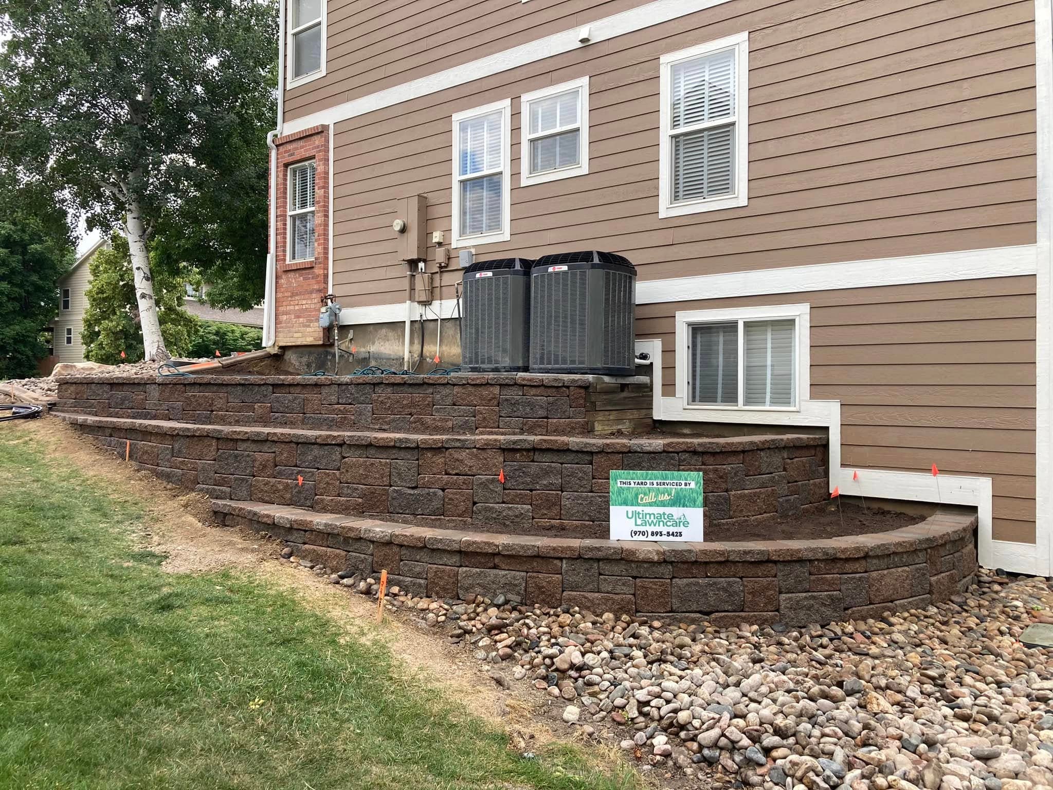 Tiered retaining wall with wooden sleepers