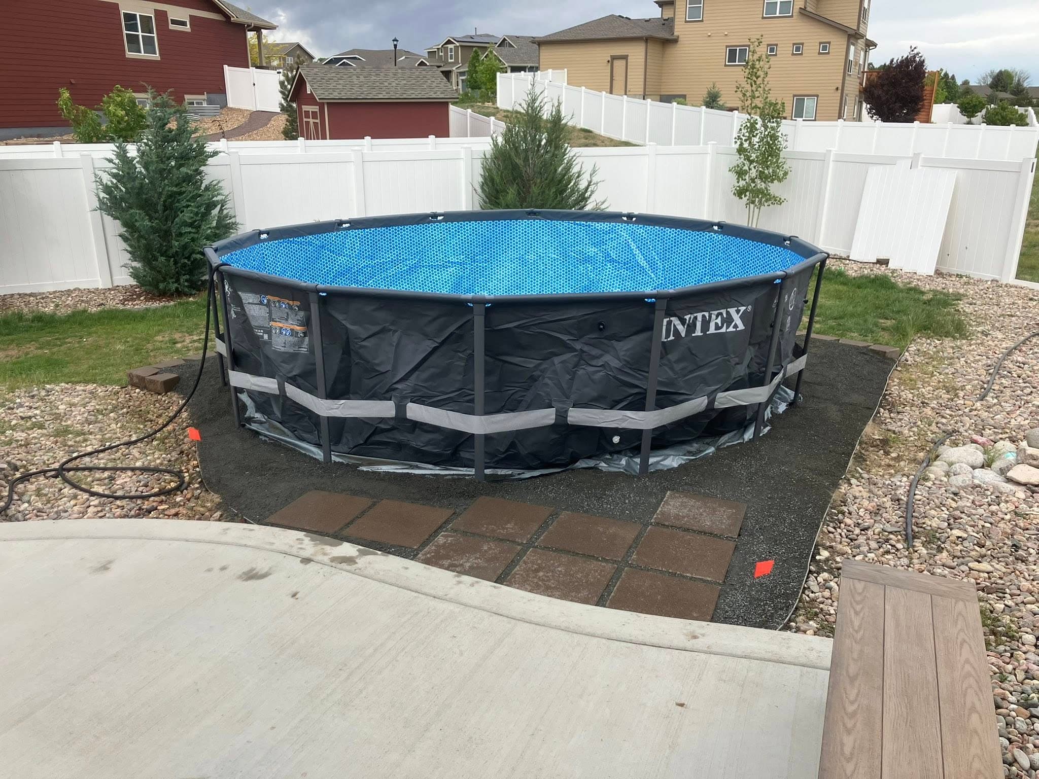 Above-ground pool on prepared paver patio